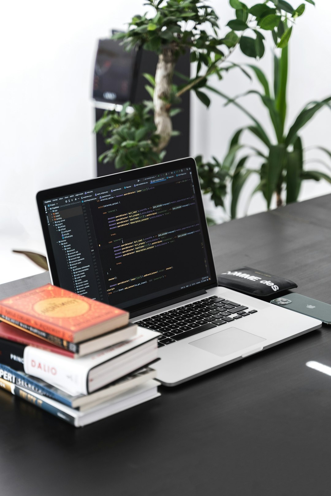 macbook-pro-on-black-wooden-table-pnbdkq2ddgm